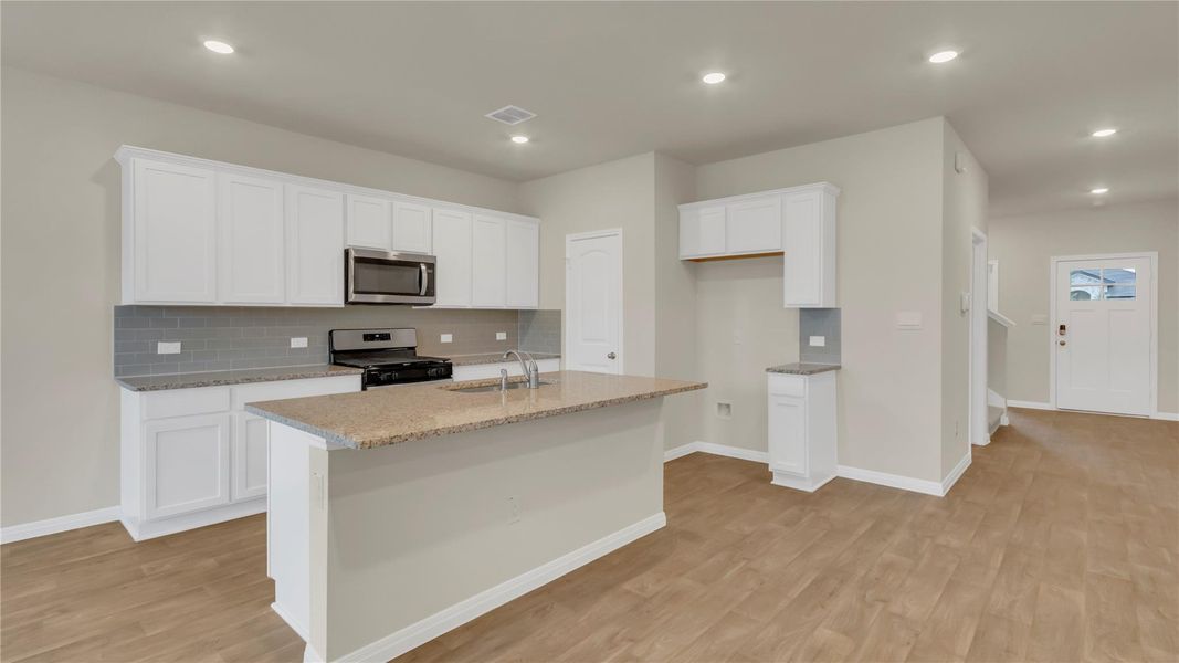 Furnished interior view inside a new home in Carillon, Manor (Image 10).