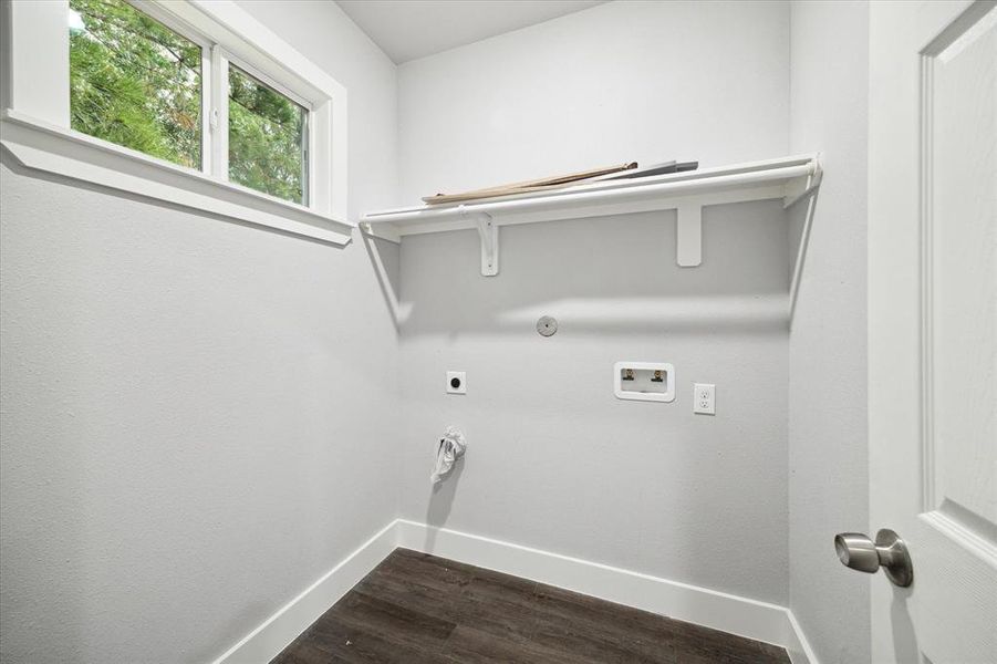 Large laundry room with built in shelf