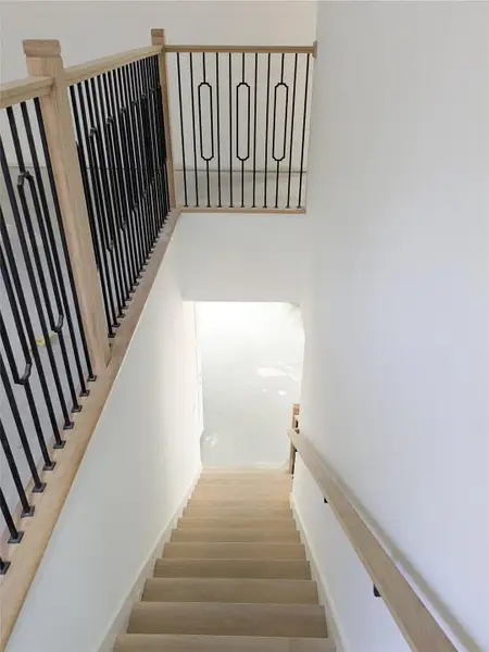 Wood Tread Stairs with detailed iron and wood railing to upstairs. Wood Tread Stairs with detailed iron and wood railing to upstairs.