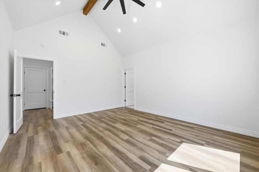 Spare room with light wood-style floors, a ceiling fan, and recessed lighting