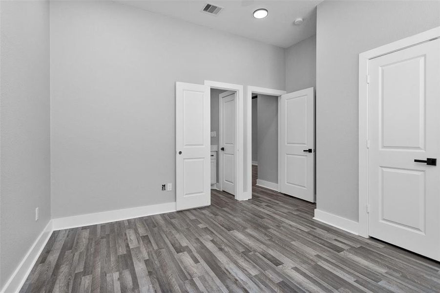 Another view of Bedroom #2 showing entry in to bath and hall.