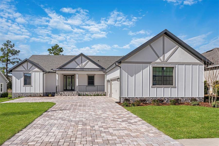 Front exterior of a new home in Southern Hills, Brooksville, FL, highlighting curb appeal (Image 1).