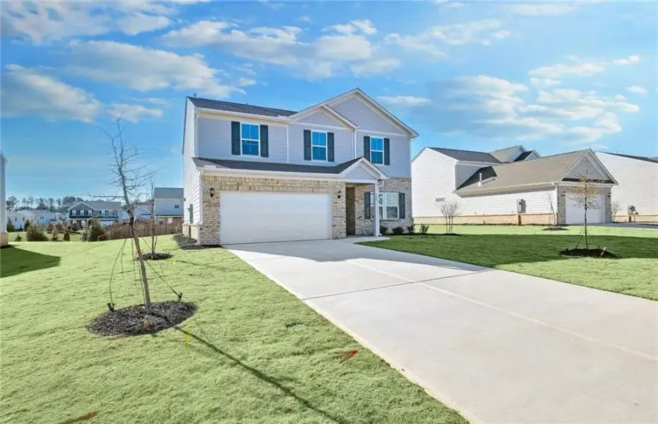 Front exterior of a new home in Anderson Point, McDonough, GA, highlighting curb appeal (Image 2). Front exterior of a new home in Anderson Point, McDonough, GA, highlighting curb appeal (Image 2).