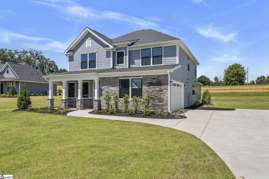 Front exterior of a new home in Double Springs, Taylors, SC, highlighting curb appeal (Image 14).