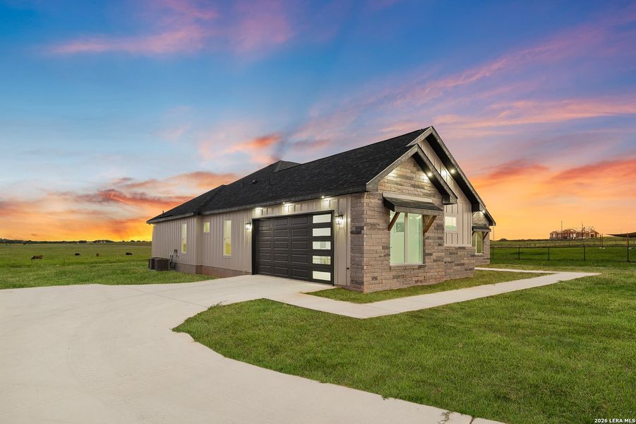 Front exterior of a new home in , La Vernia, TX, highlighting curb appeal (Image 2). Front exterior of a new home in , La Vernia, TX, highlighting curb appeal (Image 2).
