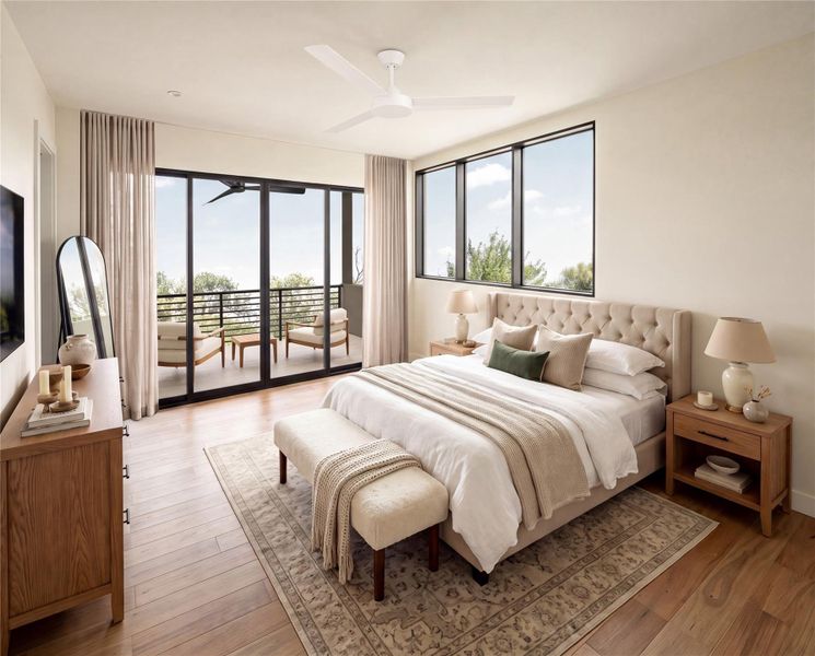 Rich hardwood floors and glass sliding doors framing outdoor views define this peaceful bedroom.