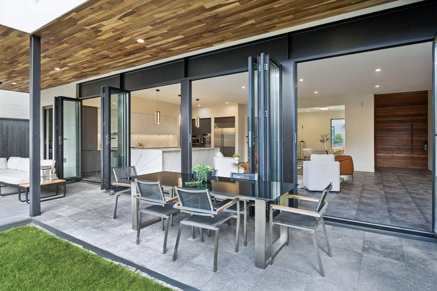 Large cover patio with plenty of siting and dining areas.