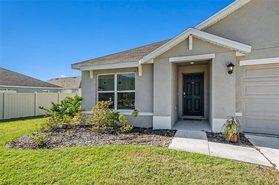 Exterior details and patio area of a home in Bella Lago, Parrish (Image 22).