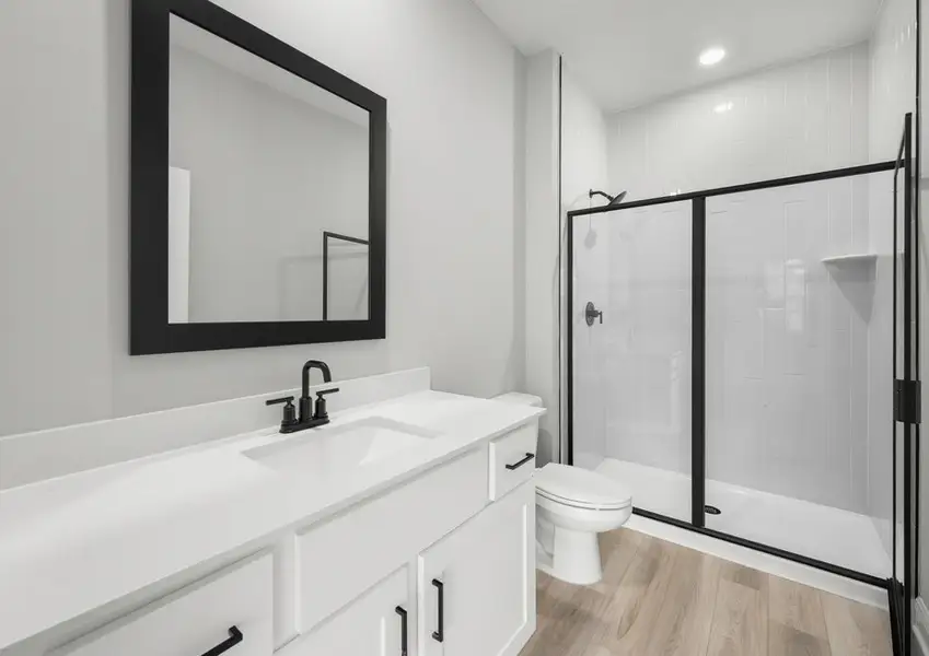 Master bathroom with a step-in shower and matte black fixtures