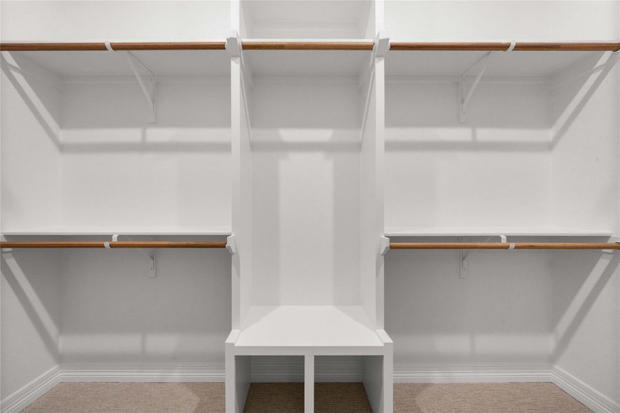 Organized living solutions in this thoughtfully designed walk-in wardrobe. Organized living solutions in this thoughtfully designed walk-in wardrobe.