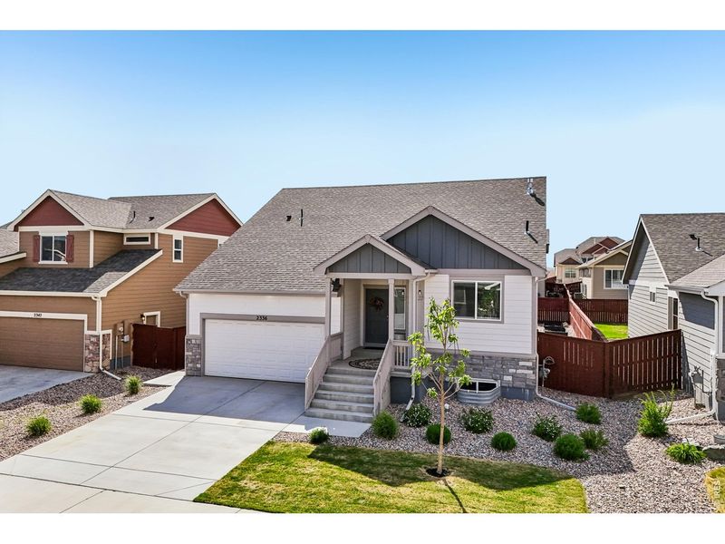 Front exterior of a new home in , Windsor, CO, highlighting curb appeal (Image 24).