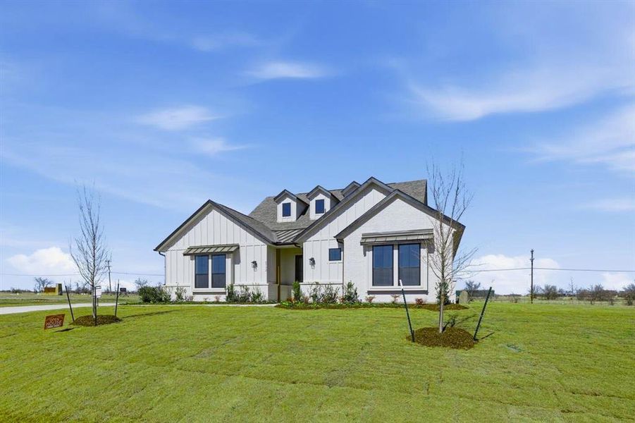 Front exterior of a new home in Highland Crossing, Celina, TX, highlighting curb appeal (Image 20).