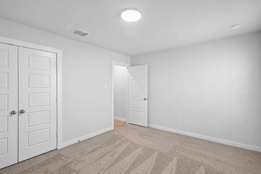 Bedroom in the Hayden home plan by Trophy Signature Homes