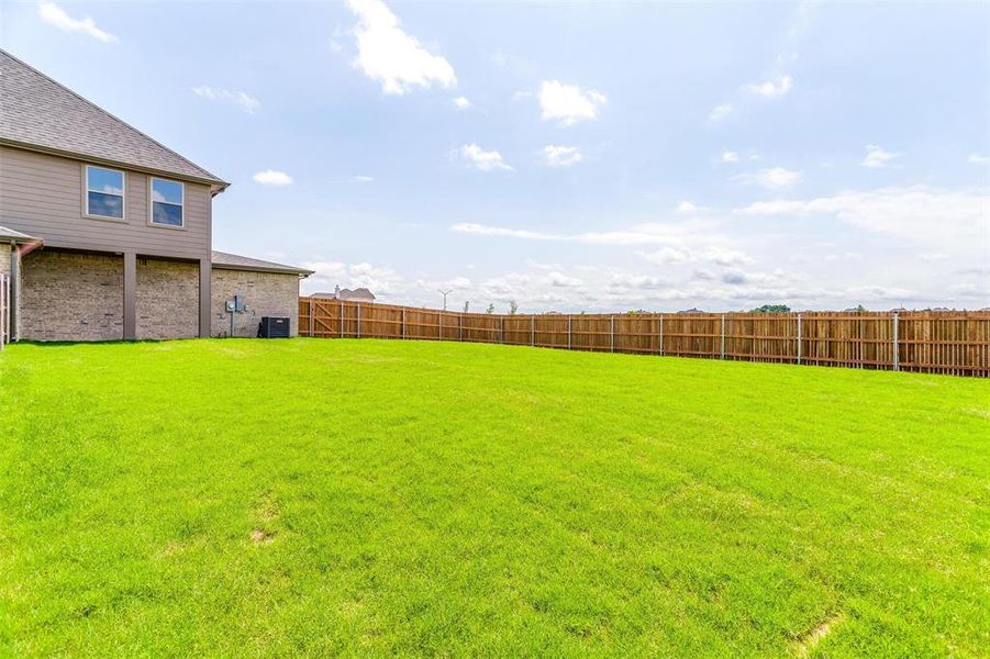 View of yard featuring central AC unit
