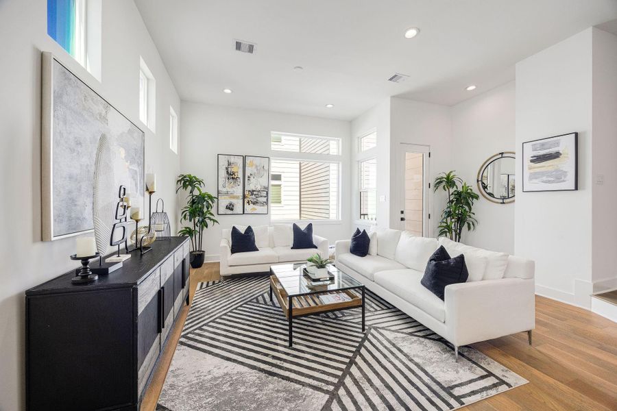 Elegant open-concept dining and living area with modern finishes and abundant natural light.