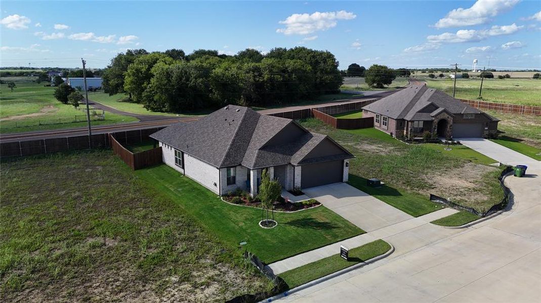 Contemporary single-story residence featuring a gray-toned brick exterior and a dark asphalt shingle roof Contemporary single-story residence featuring a gray-toned brick exterior and a dark asphalt shingle roof