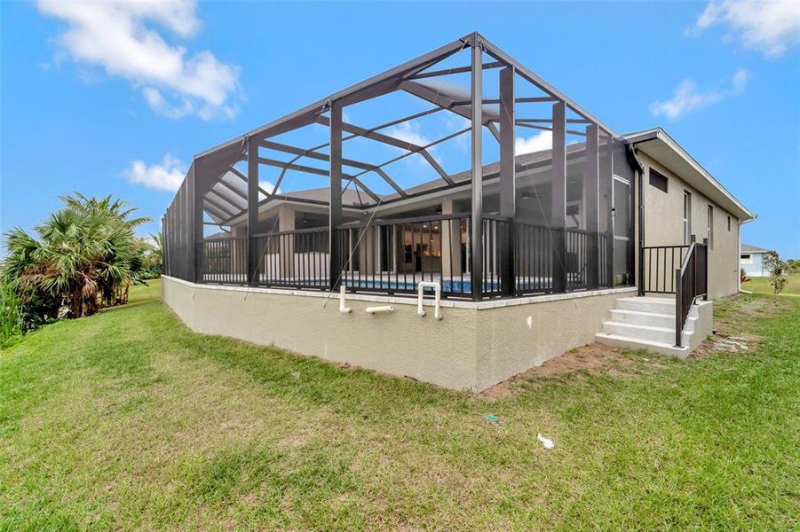 Front exterior of a new home in , Port Charlotte, FL, highlighting curb appeal (Image 23). Front exterior of a new home in , Port Charlotte, FL, highlighting curb appeal (Image 23).