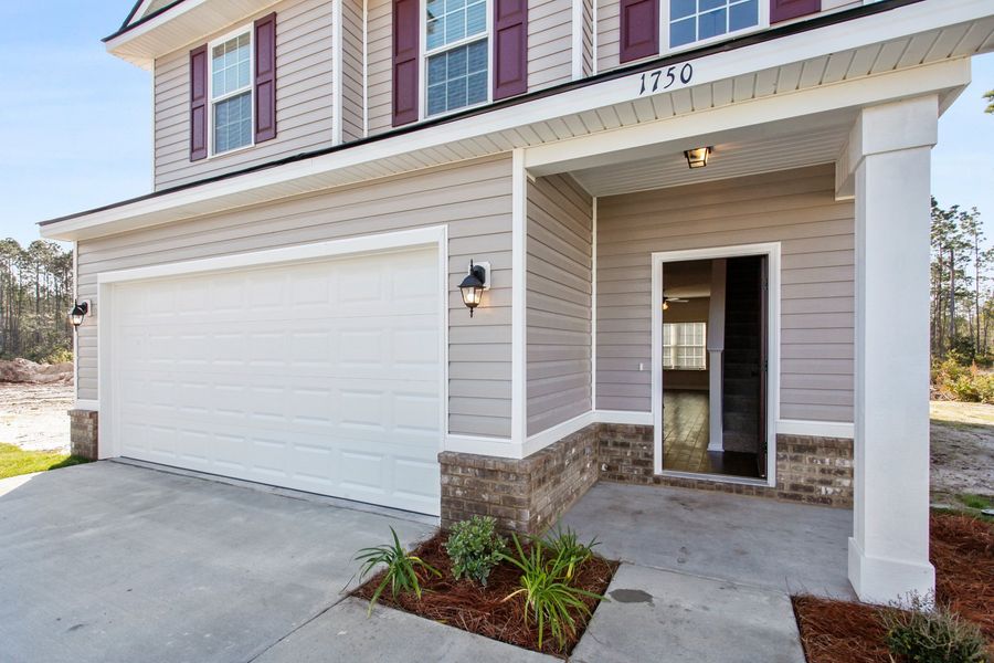 Representative exterior photo of a completed home built from the The Stacy by RTS Homes in Grand Reserve, Hinesville, GA (Image 22).