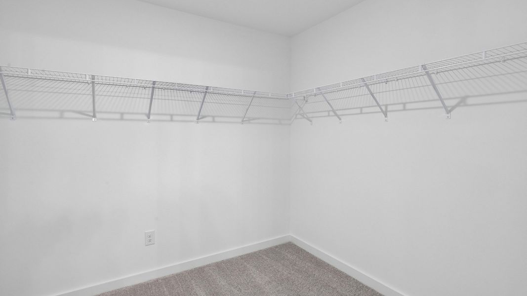 Spacious walk-in closet for primary suite