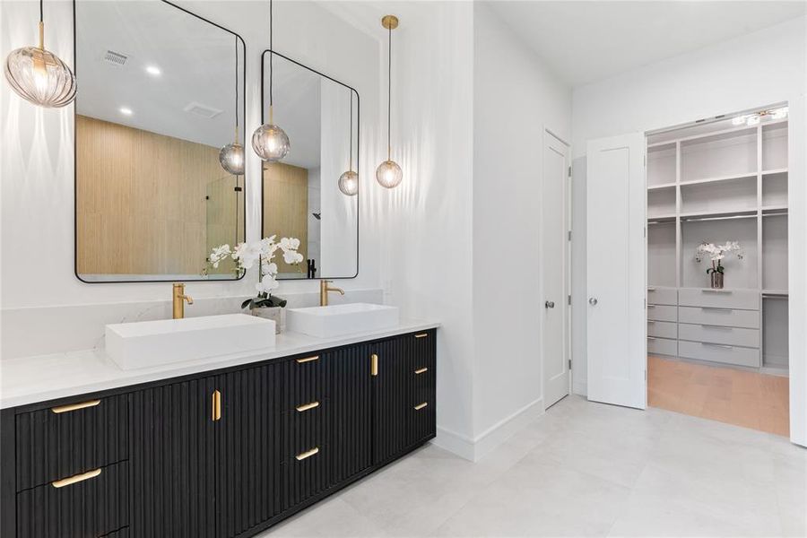 Primary bathroom, now with timeless lighting selections and hardware.