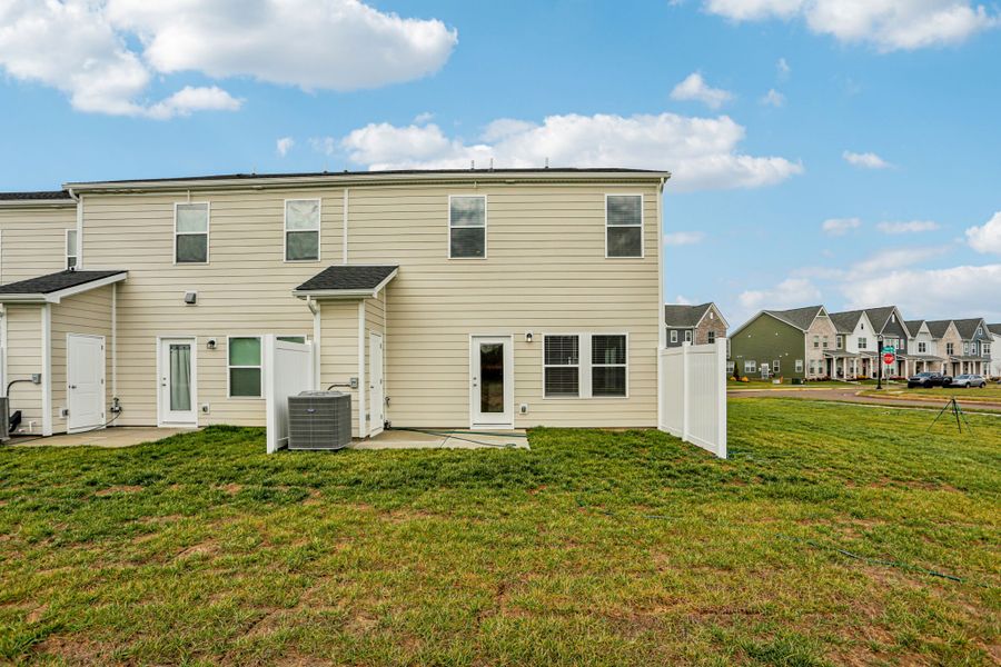 Exterior details and patio area of a home in Greystone - Parc Townhomes, Smyrna (Image 3).