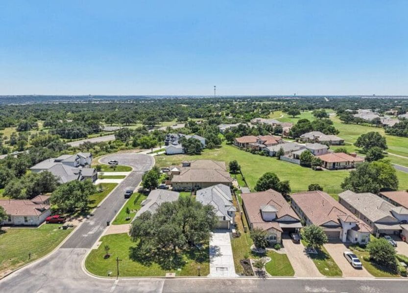 Front exterior of a new home in Cimarron Hills – Villas & Country Club, Georgetown, TX, highlighting curb appeal (Image 56).