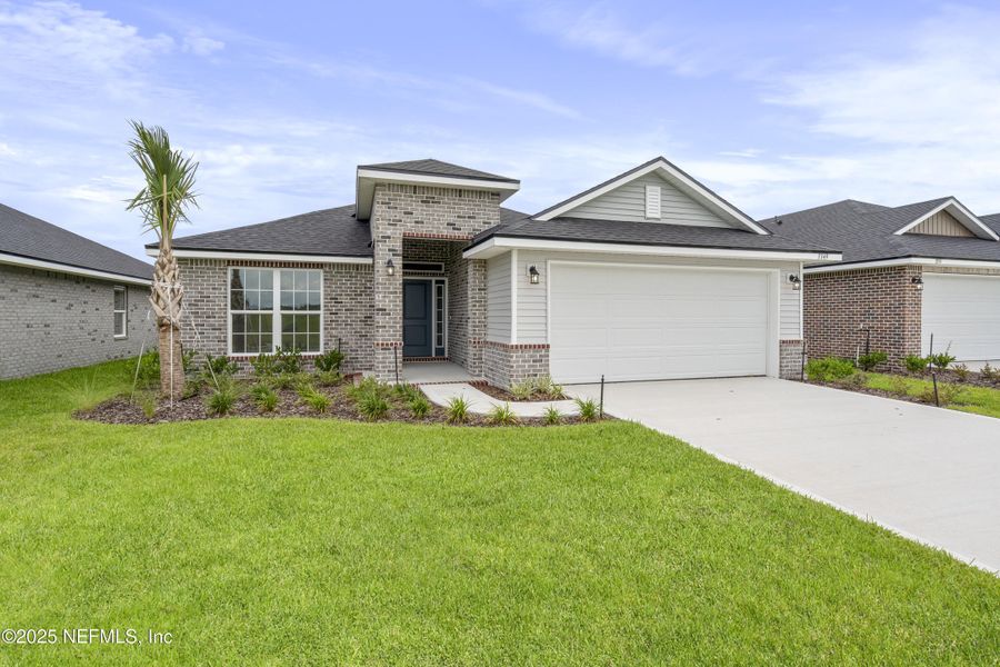 Front exterior of a new home in Shadow Crest at Rolling Hills, Green Cove Springs, FL, highlighting curb appeal (Image 12).