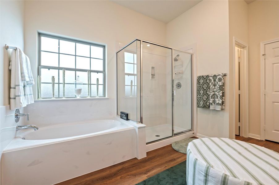 Primary suite soaking tub and separate shower. Primary suite soaking tub and separate shower.