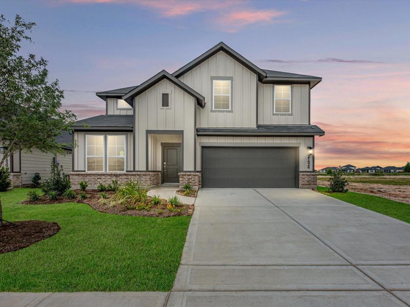Front exterior of a new home in Mason Woods, Cypress, TX, highlighting curb appeal (Image 1). Front exterior of a new home in Mason Woods, Cypress, TX, highlighting curb appeal (Image 1).