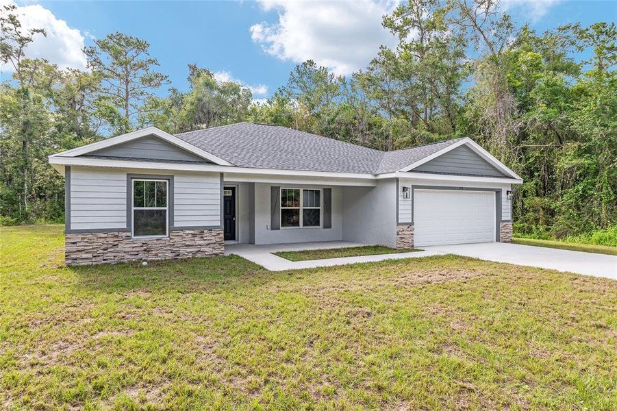 Front exterior of a new home in , Dunnellon, FL, highlighting curb appeal (Image 24).
