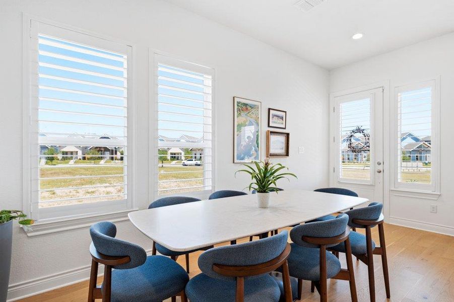 Natural light pours through elegant plantation shutters onto rich hardwood floors. Natural light pours through elegant plantation shutters onto rich hardwood floors.