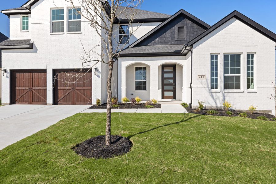 Front exterior of a new home in Edgewater, Fate, TX, highlighting curb appeal (Image 22).