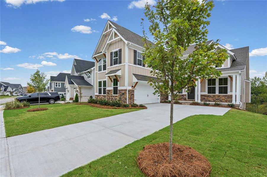 Front exterior of a new home in Twin Lakes, Hoschton, GA, highlighting curb appeal (Image 18). Front exterior of a new home in Twin Lakes, Hoschton, GA, highlighting curb appeal (Image 18).