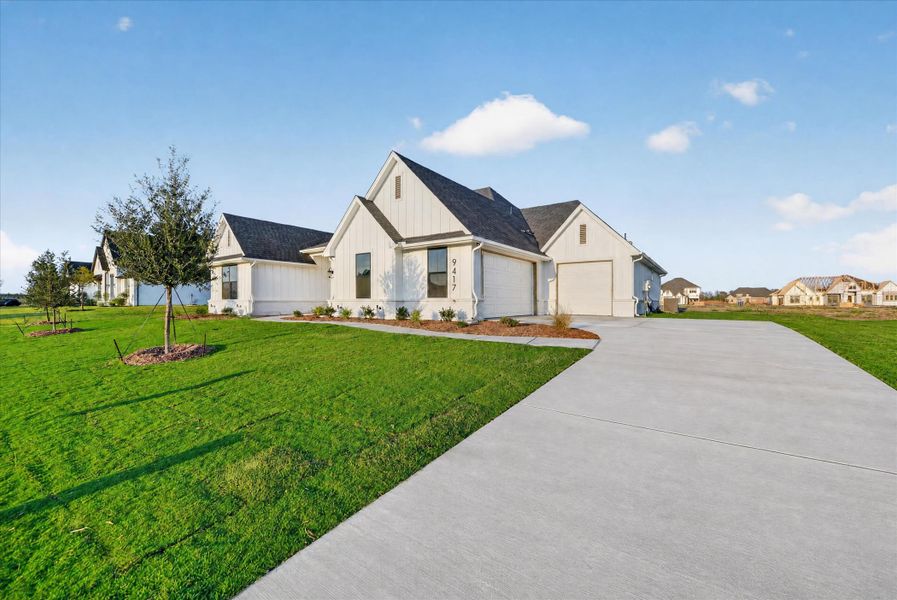 Front exterior of a new home in Paloma Ranches, Justin, TX, highlighting curb appeal (Image 21).