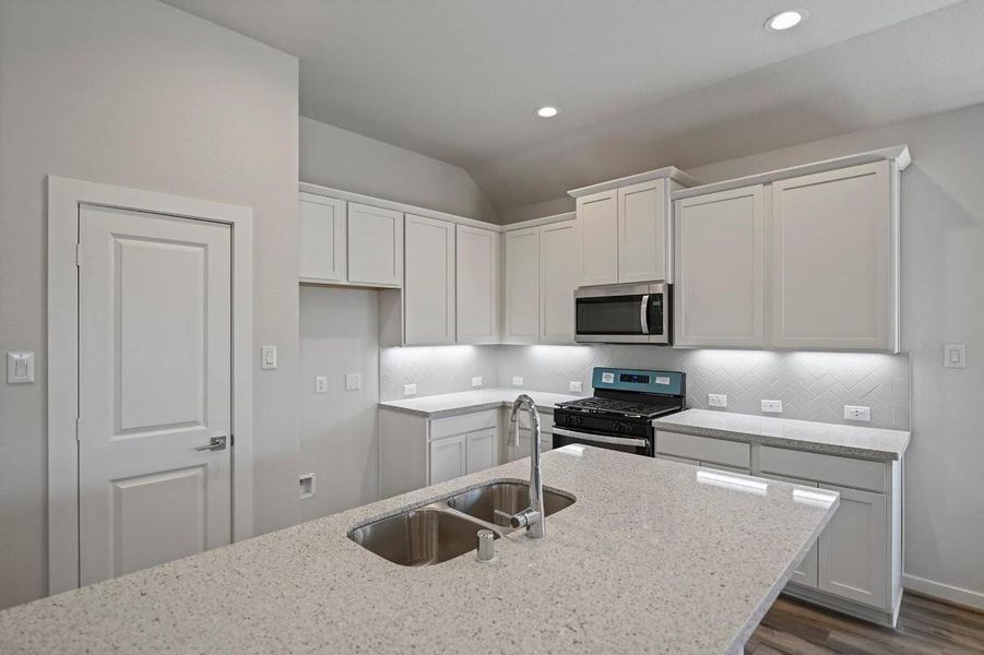 Furnished interior view inside a new home in Sunterra, Katy (Image 4).