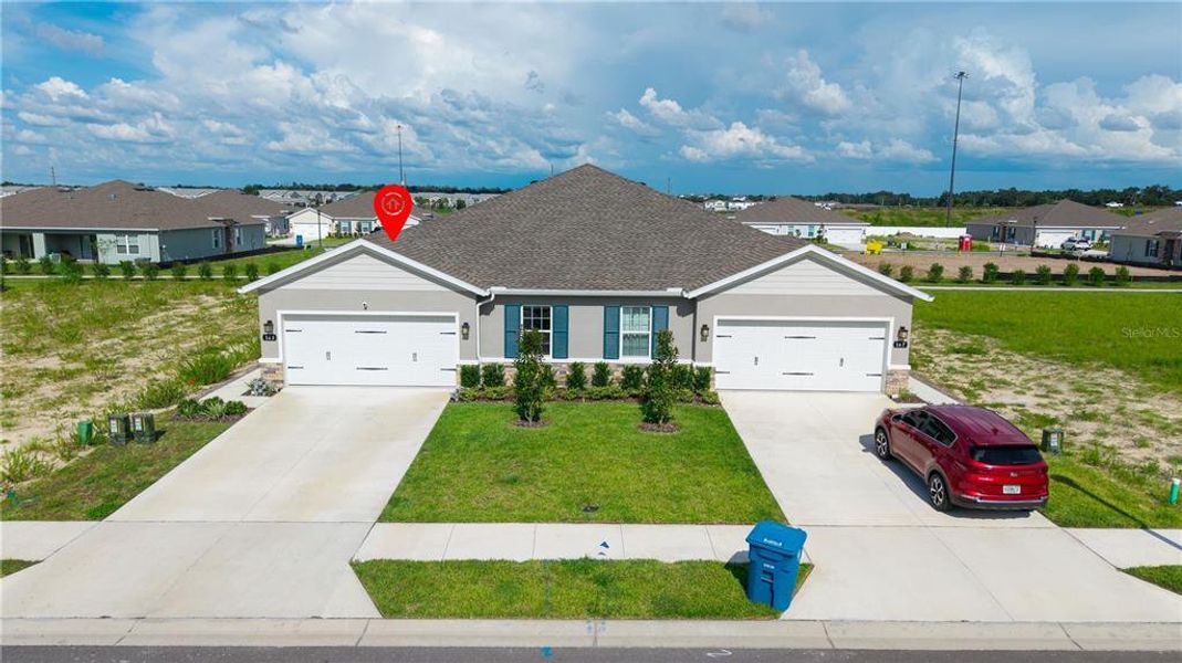 Front exterior of a new home in Park Ridge Villas, Spring Hill, FL, highlighting curb appeal (Image 28).