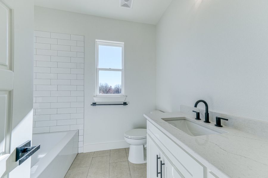 Representative furnished interior of a home built from the Jarrett 1 by Zeal Home Builders in Saddle Crest Estates, Weatherford (Image 18).