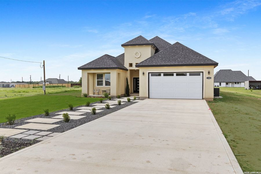 Front exterior of a new home in , Atascosa, TX, highlighting curb appeal (Image 29).
