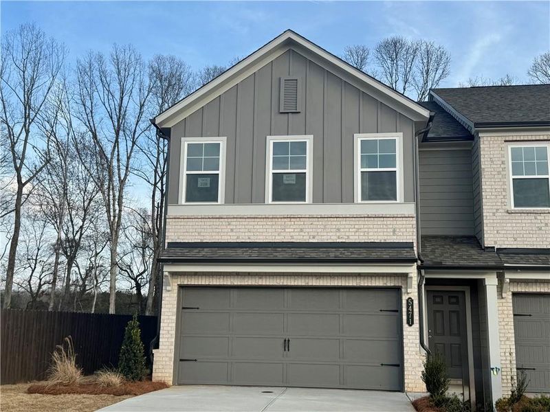 Front exterior of a new home in Eastlyn Crossing, Flowery Branch, GA, highlighting curb appeal (Image 15).