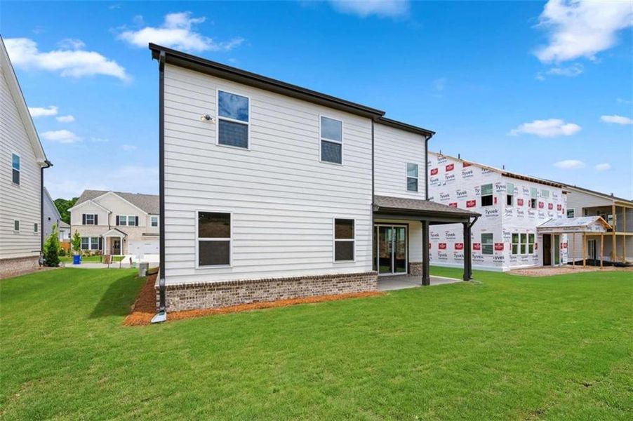 Exterior details and patio area of a home in The Paddocks at Doc Hughes, Buford (Image 22).
