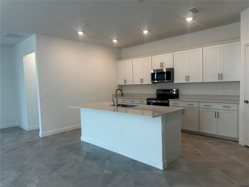Furnished interior view inside a new home in Island Lakes at Coco Bay: Executive Homes, Englewood (Image 5). Furnished interior view inside a new home in Island Lakes at Coco Bay: Executive Homes, Englewood (Image 5).