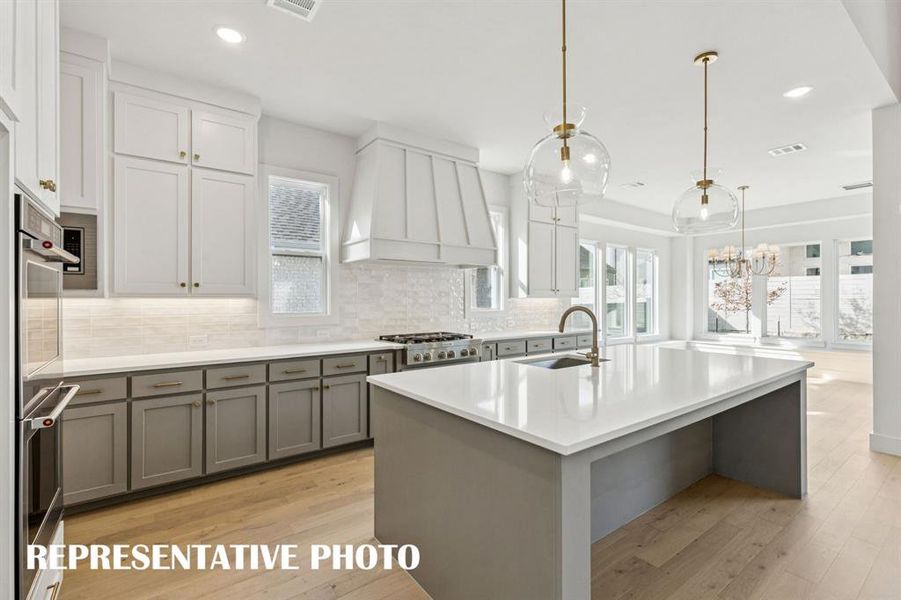 Featuring high end finishes and a striking color palette, your dream kitchen awaits!  REPRESENTATIVE PHOTO