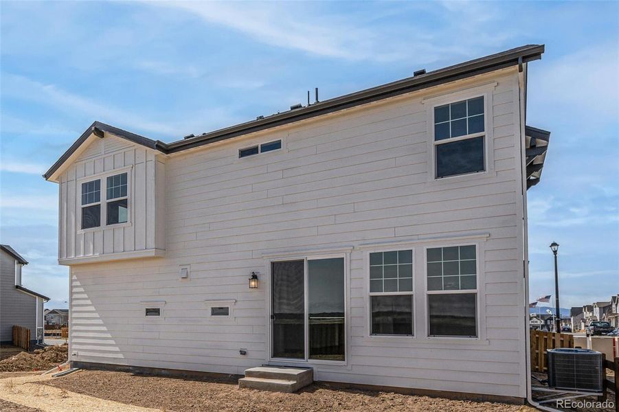 Front exterior of a new home in , Commerce City, CO, highlighting curb appeal (Image 21).