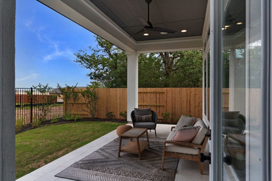 Exterior details and patio area of a home in The Colony- Pine Cove, Bastrop (Image 4).