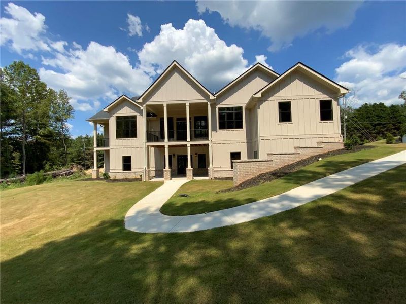 Front exterior of a new home in , Conyers, GA, highlighting curb appeal (Image 3). Front exterior of a new home in , Conyers, GA, highlighting curb appeal (Image 3).