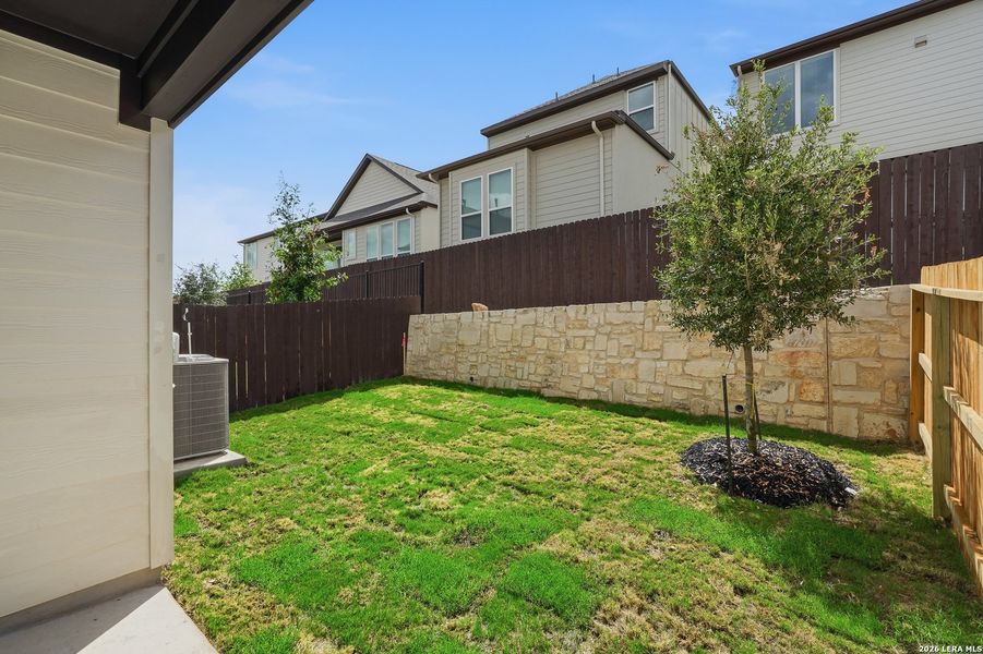 Exterior details and patio area of a home in Centero at Stone Oak, San Antonio (Image 25).