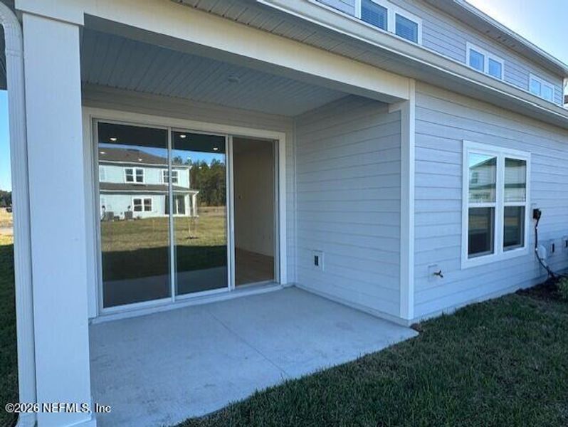 Exterior details and patio area of a home in Brook Forest - Townhomes, St. Augustine (Image 17).