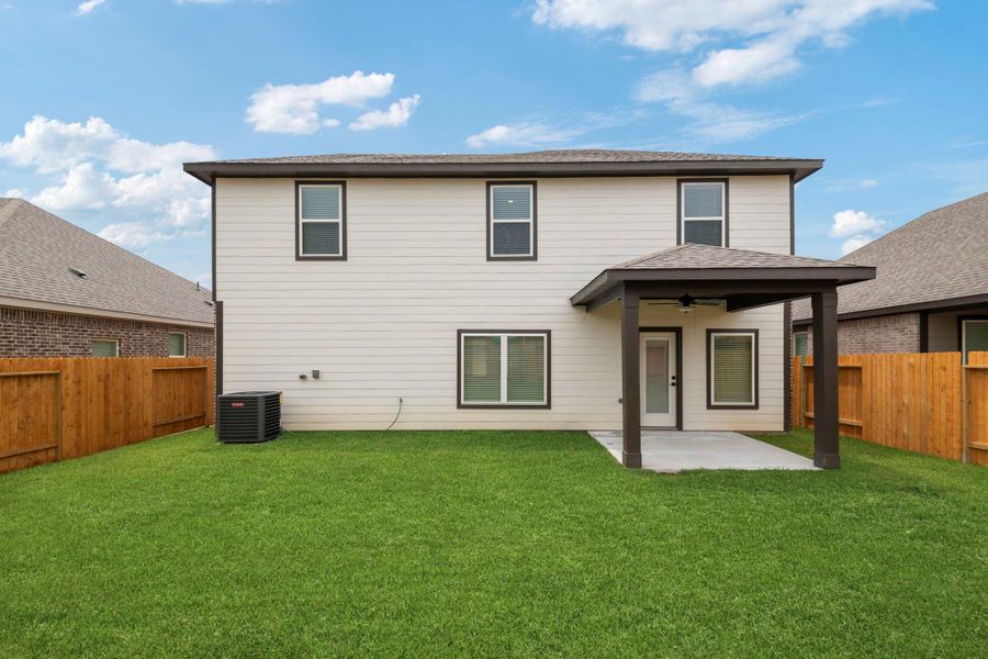 Front exterior of a new home in Magnolia Woods, Magnolia, TX, highlighting curb appeal (Image 2). Front exterior of a new home in Magnolia Woods, Magnolia, TX, highlighting curb appeal (Image 2).