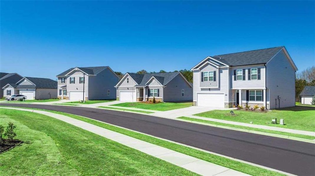 Front exterior of a new home in Champion's Run, Lithonia, GA, highlighting curb appeal (Image 16). Front exterior of a new home in Champion's Run, Lithonia, GA, highlighting curb appeal (Image 16).