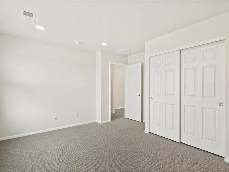 Spacious, unfurnished interior of a new home in Buffalo Highlands: The Flora Collection, Commerce City (Image 15).